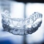 Invisalign vs. Traditional Braces: Making the Right Choice for Your Smile grupi logo